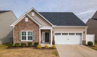 Roof repair services in Lafayette LA contractor inspecting residential roofing shingles for storm damage