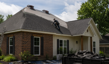 Professional roof repair near a Youngsville, Louisiana home with roofing contractors replacing shingles on a residential roof after storm damage.